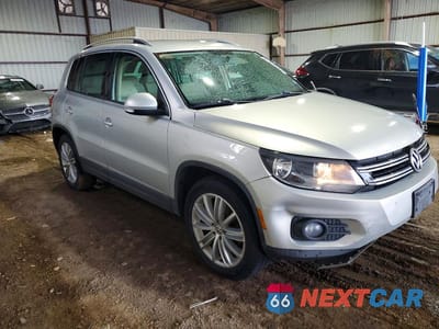 Czwarte zdjęcie samochodu z boku: 2014 VOLKSWAGEN TIGUAN S VIN:WVGAV3AX2EW556751 - miniatura