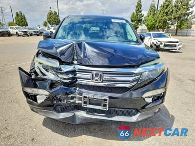 Piąte zdjęcie samochodu w środku: 2017 HONDA PILOT EXL VIN:5FNYF5H53HB010159 - miniatura