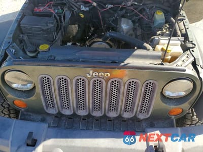 Zdjęcie 12 z 14 samochodu: 2007 JEEP WRANGLER SAHARA VIN:1J4GA59147L182597 - miniatura