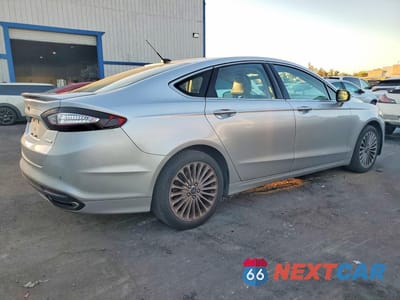 Trzecie zdjęcie samochodu z tyłu: 2016 FORD FUSION TITANIUM VIN:3FA6P0K92GR307560 - miniatura