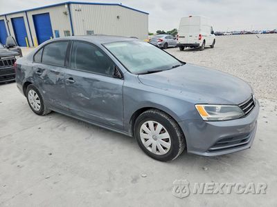 Czwarte zdjęcie samochodu z boku: 2015 VOLKSWAGEN JETTA BASE VIN:3VW2K7AJ0FM320604 - miniatura