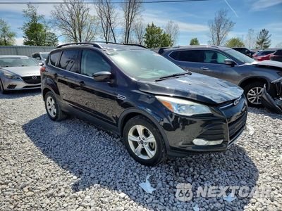 Czwarte zdjęcie samochodu z boku: 2015 FORD ESCAPE SE VIN:1FMCU9G90FUB46597 - miniatura