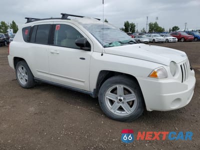 Czwarte zdjęcie samochodu z boku: 2010 JEEP COMPASS SPORT VIN:1J4NF4FB7AD547484 - miniatura