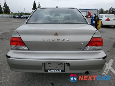 Zdjęcie 6 z 14 samochodu: 2002 MITSUBISHI LANCER LS VIN:JA3AJ36EX2U036410 - miniatura