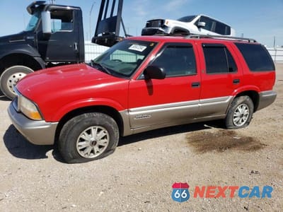 1999 GMC JIMMY 1GKDT13W7X2542388 - główne zdjęcie licytacji z USA - miniatura