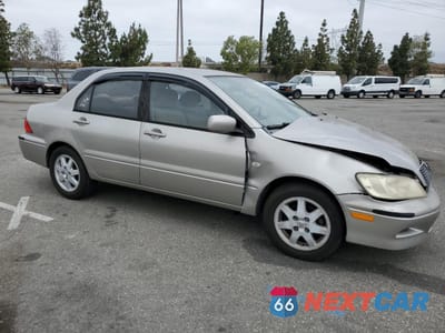 Czwarte zdjęcie samochodu z boku: 2002 MITSUBISHI LANCER LS VIN:JA3AJ36EX2U036410 - miniatura