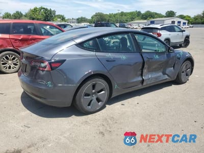 Trzecie zdjęcie samochodu z tyłu: 2023 TESLA MODEL 3 VIN:5YJ3E1EA9PF397502 - miniatura