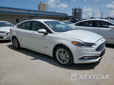 Czwarte zdjęcie samochodu z boku: 2017 FORD FUSION SE HYBRID VIN:3FA6P0LU8HR409417 - miniatura