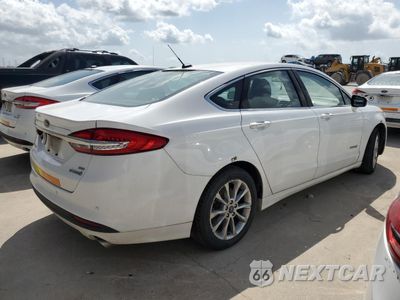 Trzecie zdjęcie samochodu z tyłu: 2018 FORD FUSION SE HYBRID VIN:3FA6P0LU0JR171701 - miniatura