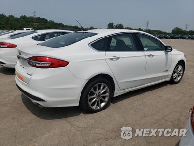 Trzecie zdjęcie samochodu z tyłu: 2017 FORD FUSION SE HYBRID VIN:3FA6P0LU9HR409085 - miniatura