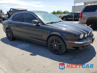 Czwarte zdjęcie samochodu z boku: 2003 JAGUAR X-TYPE 2.5 VIN:SAJEA51D43XC94231 - miniatura