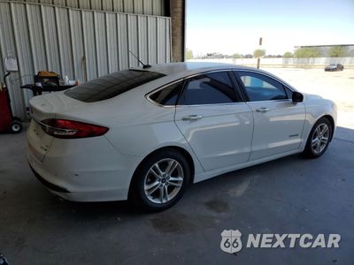 Trzecie zdjęcie samochodu z tyłu: 2018 FORD FUSION SE HYBRID VIN:3FA6P0LU5JR171581 - miniatura
