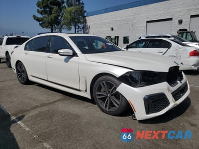 Czwarte zdjęcie samochodu z boku: 2020 BMW 750 XI VIN:WBA7U2C01LGM27383 - miniatura