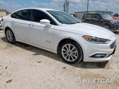 Czwarte zdjęcie samochodu z boku: 2017 FORD FUSION SE HYBRID VIN:3FA6P0LU2HR409042 - miniatura