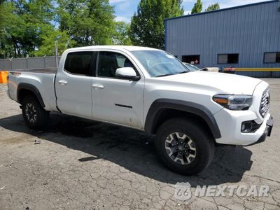 Czwarte zdjęcie samochodu z boku: 2023 TOYOTA TACOMA DOUBLE CAB VIN:3TMDZ5BN6PM168505 - miniatura