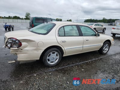 Trzecie zdjęcie samochodu z tyłu: 2000 LINCOLN CONTINENTAL VIN:1LNHM97V2YY764261 - miniatura
