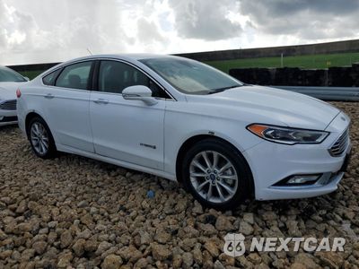 Czwarte zdjęcie samochodu z boku: 2017 FORD FUSION SE HYBRID VIN:3FA6P0LU7HR409425 - miniatura