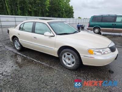 Czwarte zdjęcie samochodu z boku: 2000 LINCOLN CONTINENTAL VIN:1LNHM97V2YY764261 - miniatura