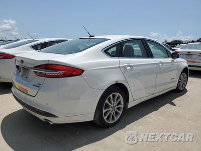 Trzecie zdjęcie samochodu z tyłu: 2017 FORD FUSION SE HYBRID VIN:3FA6P0LU3HR409258 - miniatura