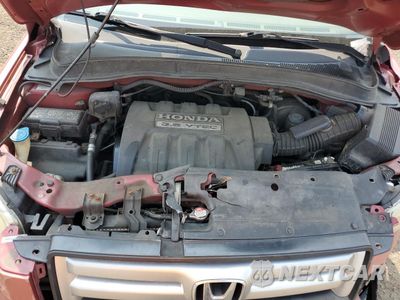 Zdjęcie 11 z 14 samochodu: 2006 HONDA PILOT EX VIN:2HKYF18426H502972 - miniatura