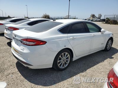 Trzecie zdjęcie samochodu z tyłu: 2017 FORD FUSION SE HYBRID VIN:3FA6P0LU0HR409301 - miniatura