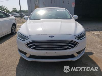 Piąte zdjęcie samochodu w środku: 2018 FORD FUSION SE HYBRID VIN:3FA6P0LU2JR172056 - miniatura