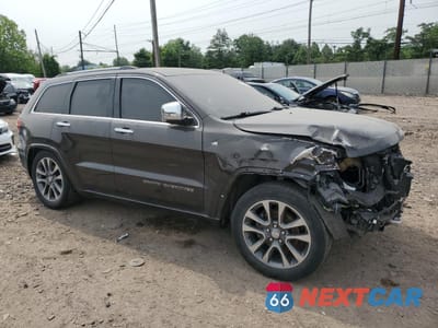Czwarte zdjęcie samochodu z boku: 2017 JEEP GRAND CHEROKEE OVERLAND VIN:1C4RJFCG0HC699995 - miniatura