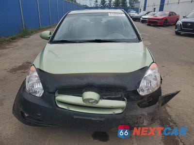 Piąte zdjęcie samochodu w środku: 2007 HYUNDAI ACCENT BASE VIN:KMHCN35C47U013870 - miniatura
