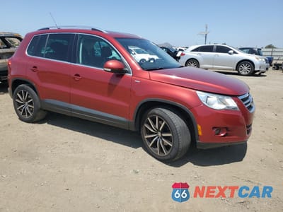 Czwarte zdjęcie samochodu z boku: 2010 VOLKSWAGEN TIGUAN SE VIN:WVGBV7AX2AW003569 - miniatura