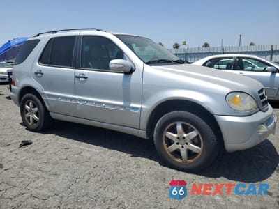 Czwarte zdjęcie samochodu z boku: 2002 MERCEDES-BENZ ML 500 VIN:4JGAB75E32A362473 - miniatura