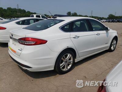 Trzecie zdjęcie samochodu z tyłu: 2018 FORD FUSION SE HYBRID VIN:3FA6P0LU8JR171977 - miniatura