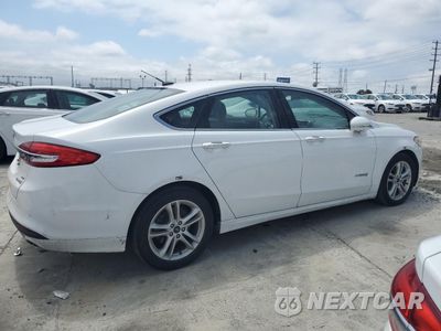 Trzecie zdjęcie samochodu z tyłu: 2018 FORD FUSION SE HYBRID VIN:3FA6P0LU2JR172140 - miniatura