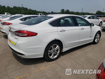 Trzecie zdjęcie samochodu z tyłu: 2018 FORD FUSION SE HYBRID VIN:3FA6P0LU6JR129873 - miniatura