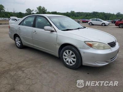 Czwarte zdjęcie samochodu z boku: 2002 TOYOTA CAMRY LE VIN:JTDBE32KX20045864 - miniatura