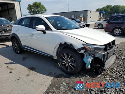 Czwarte zdjęcie samochodu z boku: 2017 MAZDA CX-3 GRAND TOURING VIN:JM1DKFD74H0149044 - miniatura