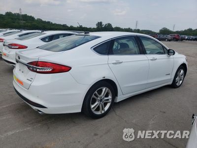 Trzecie zdjęcie samochodu z tyłu: 2017 FORD FUSION SE HYBRID VIN:3FA6P0LU1HR410067 - miniatura