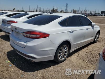 Trzecie zdjęcie samochodu z tyłu: 2017 FORD FUSION SE HYBRID VIN:3FA6P0LU4HR409706 - miniatura