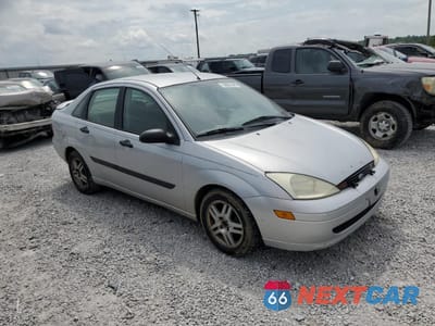 Czwarte zdjęcie samochodu z boku: 2002 FORD FOCUS LX VIN:1FAFP33P72W253645 - miniatura