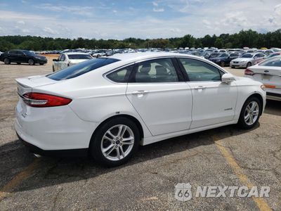 Trzecie zdjęcie samochodu z tyłu: 2018 FORD FUSION SE HYBRID VIN:3FA6P0LUXJR281915 - miniatura