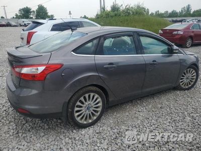 Trzecie zdjęcie samochodu z tyłu: 2012 FORD FOCUS TITANIUM VIN:1FAHP3J2XCL289073 - miniatura