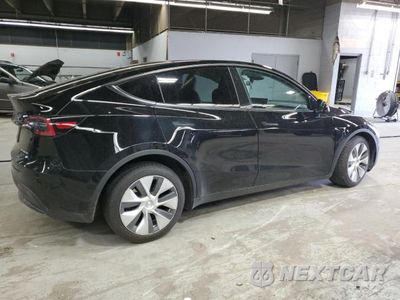 Trzecie zdjęcie samochodu z tyłu: 2023 TESLA MODEL Y VIN:7SAYGDEE5PA195602 - miniatura