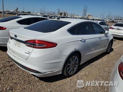 Trzecie zdjęcie samochodu z tyłu: 2017 FORD FUSION SE HYBRID VIN:3FA6P0LU2HR409302 - miniatura