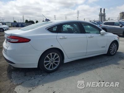 Trzecie zdjęcie samochodu z tyłu: 2017 FORD FUSION SE HYBRID VIN:3FA6P0LU9HR409748 - miniatura