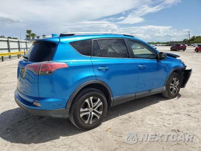 Trzecie zdjęcie samochodu z tyłu: 2018 TOYOTA RAV4 LE VIN:JTMZFREV1JJ207104 - miniatura