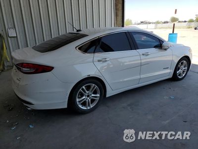 Trzecie zdjęcie samochodu z tyłu: 2018 FORD FUSION SE HYBRID VIN:3FA6P0LU0JR171584 - miniatura