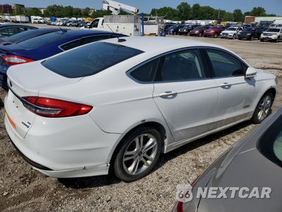 Trzecie zdjęcie samochodu z tyłu: 2018 FORD FUSION SE HYBRID VIN:3FA6P0LU3JR172017 - miniatura