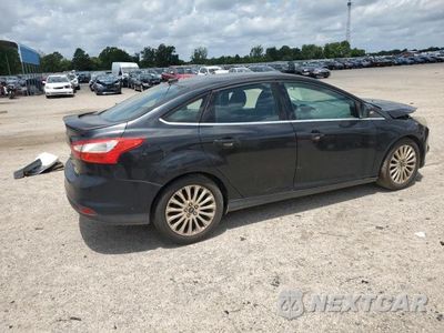 Trzecie zdjęcie samochodu z tyłu: 2012 FORD FOCUS TITANIUM VIN:1FAHP3J24CL407778 - miniatura