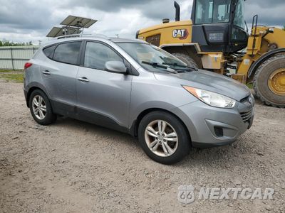 Czwarte zdjęcie samochodu z boku: 2010 HYUNDAI TUCSON GLS VIN:KM8JUCAC6AU080641 - miniatura
