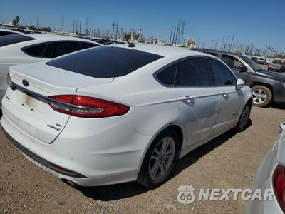 Trzecie zdjęcie samochodu z tyłu: 2018 FORD FUSION SE HYBRID VIN:3FA6P0LU1JR171609 - miniatura