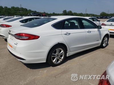 Trzecie zdjęcie samochodu z tyłu: 2018 FORD FUSION SE HYBRID VIN:3FA6P0LU6JR172061 - miniatura